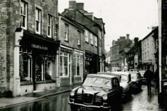 000086 Chard and Sons foot ware shop on the left 1966